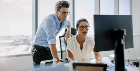 business people viewing computer in office 650x330
