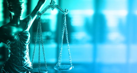 justice scales with blue green gradient overlay