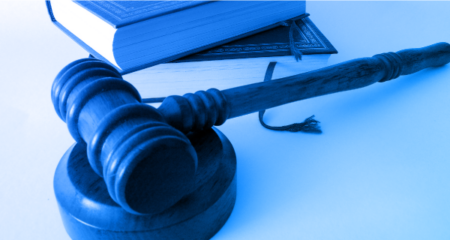gavel and books with green blue gradient overlay